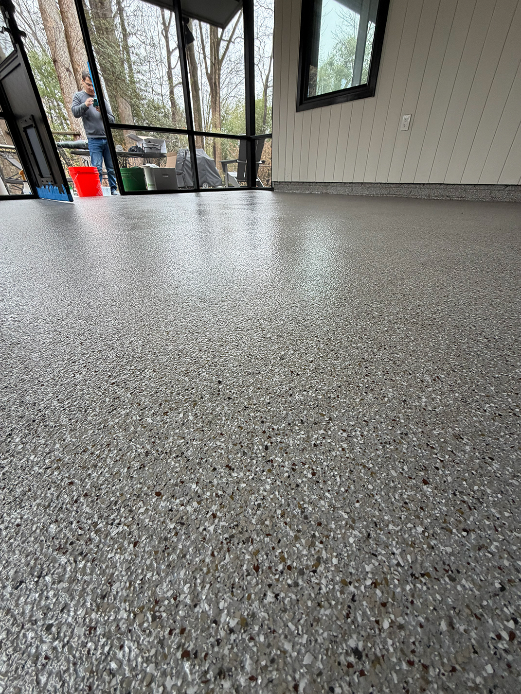 Premium flake epoxy garage floor with sports car
